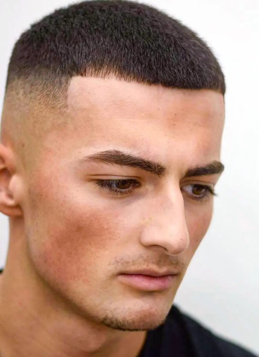 Buzz cut back profile showing neckline shape.