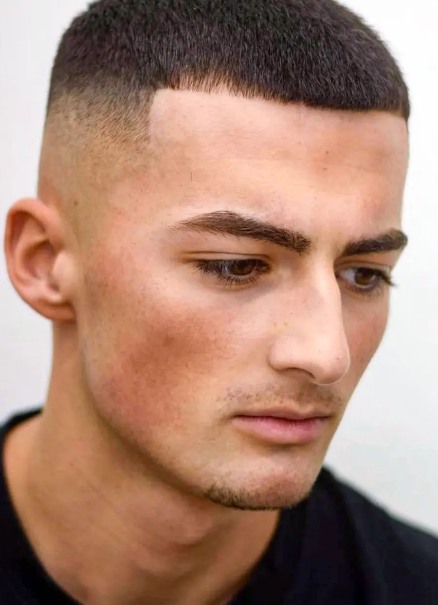 Buzz cut three-quarter profile for clipper blend visibility.