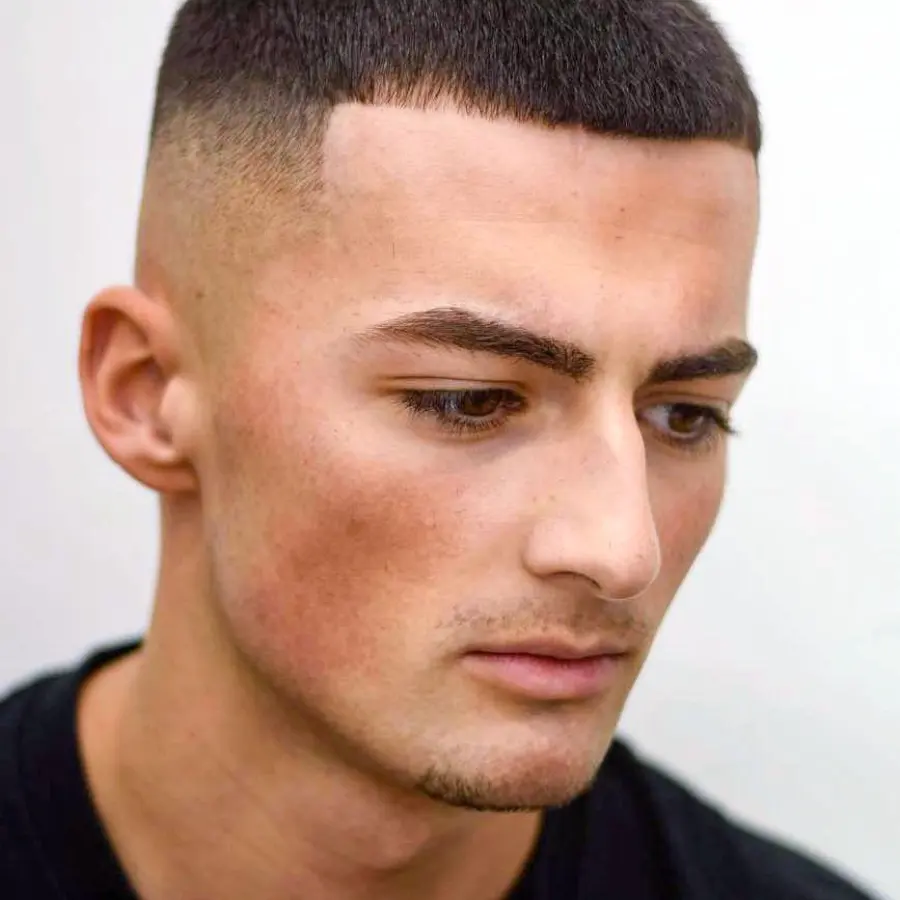 Buzz cut top view showing even clipper length across crown.