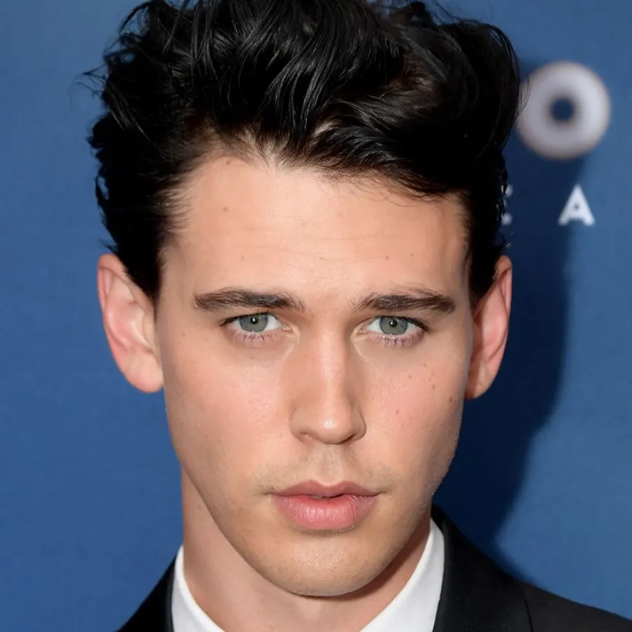 Quiff haircut three-quarter angle showing height and flow.