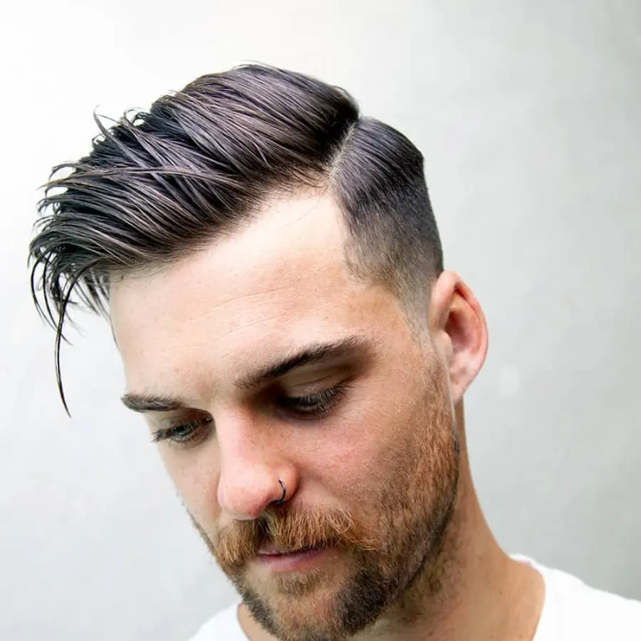 Side part haircut back profile with clean lower blend.