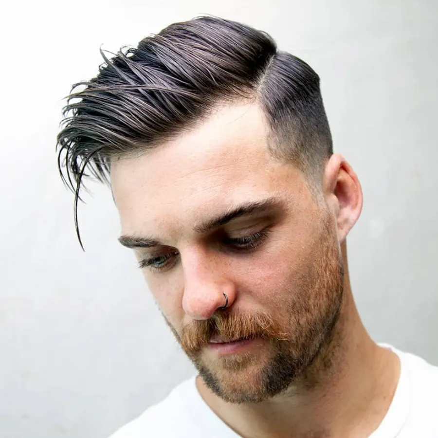 Side part haircut three-quarter profile for volume and structure.