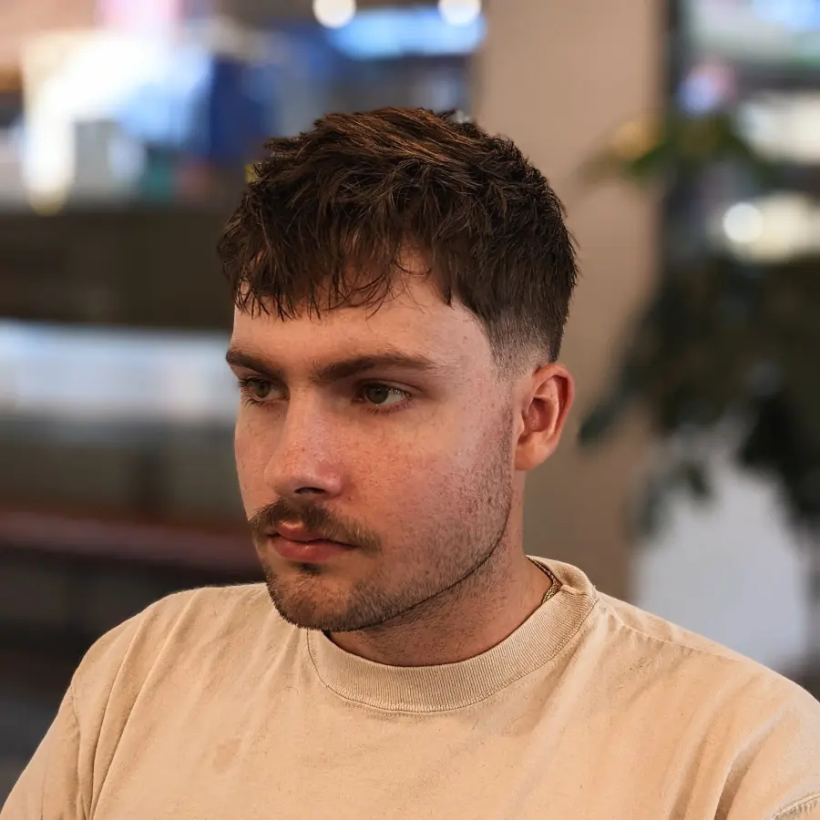 Textured crop top view showing directional texture pattern.